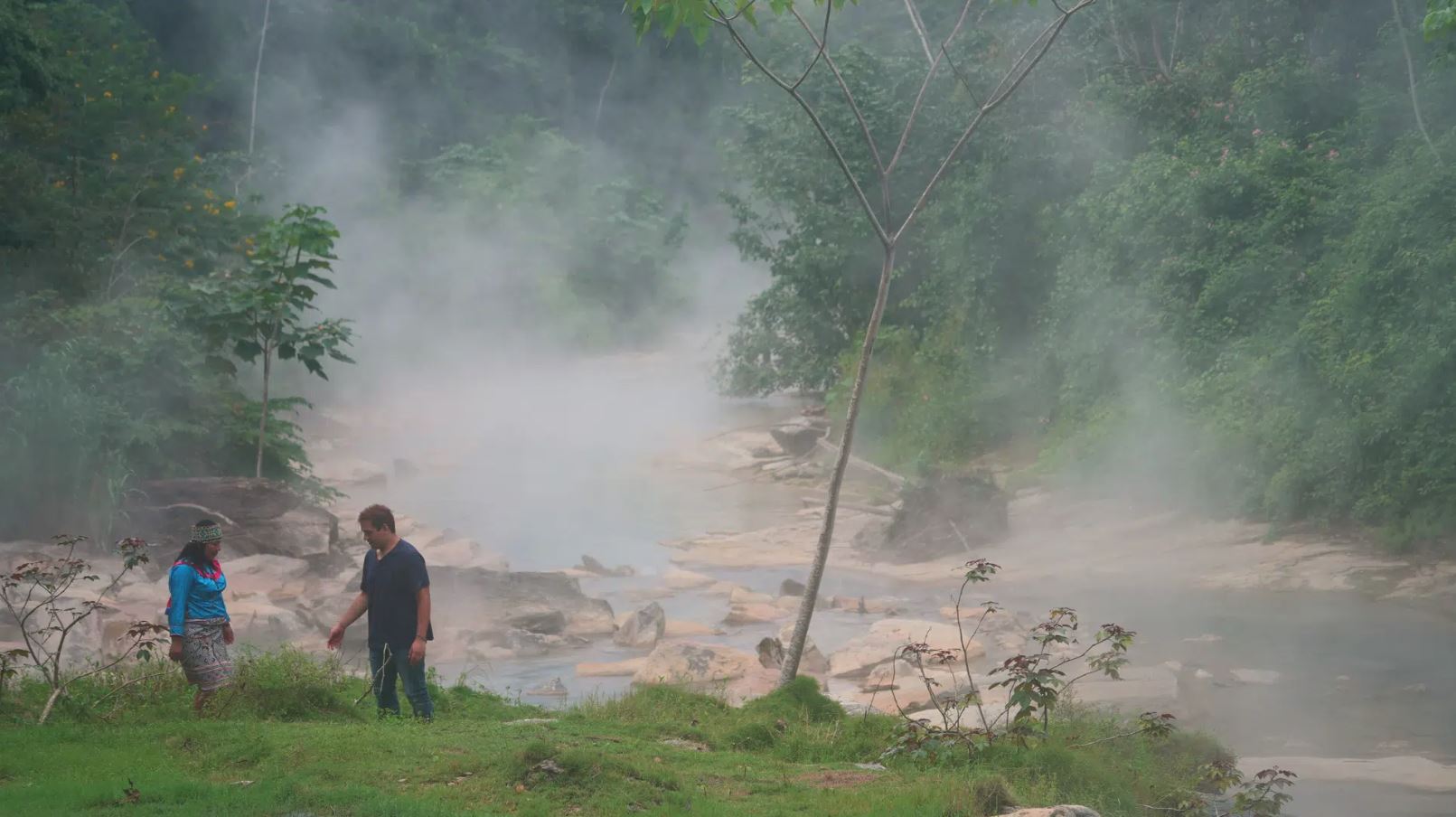 Teacher gesturing through a classroom filled with fog